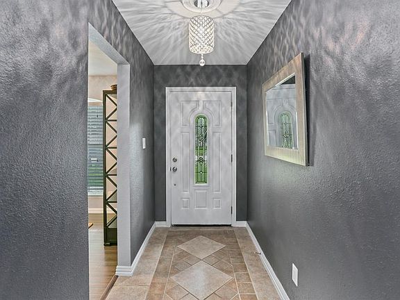 Did I mention the home is fully remodeled? New door, new tile work (which is designed to look like a welcome rug), new lighting and new designer "Digita Blue-Gray" accent paint that works beautifully with the light grey walls throughout the home.