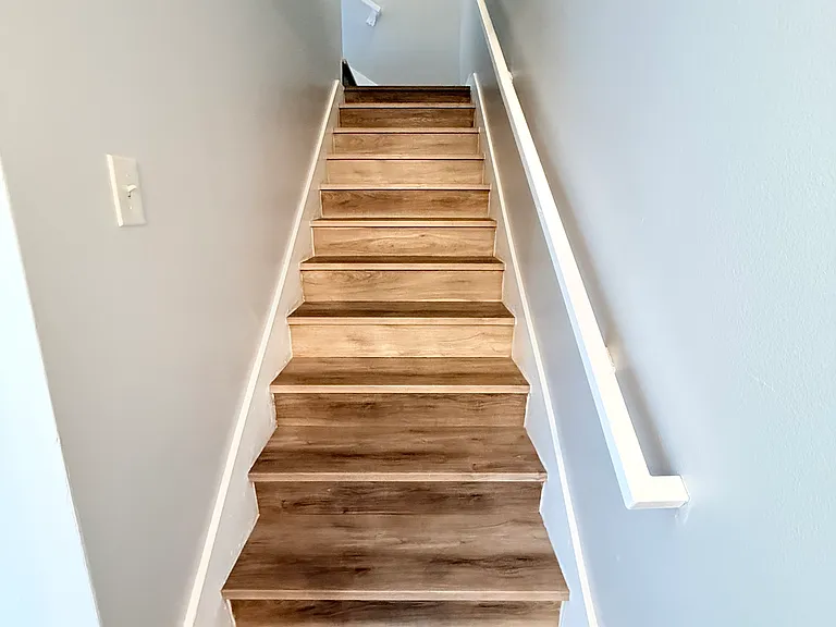 New vinyl plank flooring staircase to upstairs bedrooms