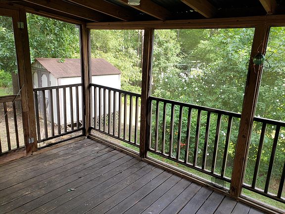 Covered deck overlooking yard