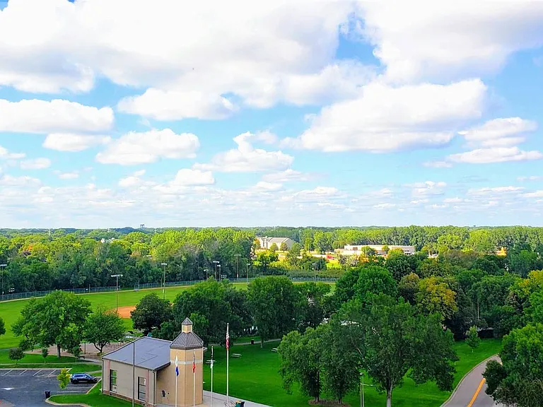 Situated near several parks, including Centennial Park, which is home to a playground, baseball field, and a large open field perfect for picnics and outdoor activities.