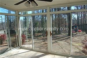 Sun Room Is Screened And Has Sliding Glass Doors.