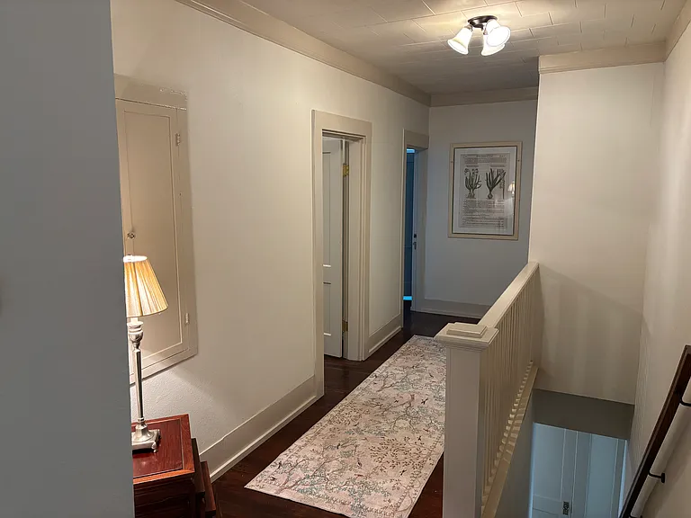 The lighting and decorative accents like rugs and lamps give a warm and cozy vibe throughout the home