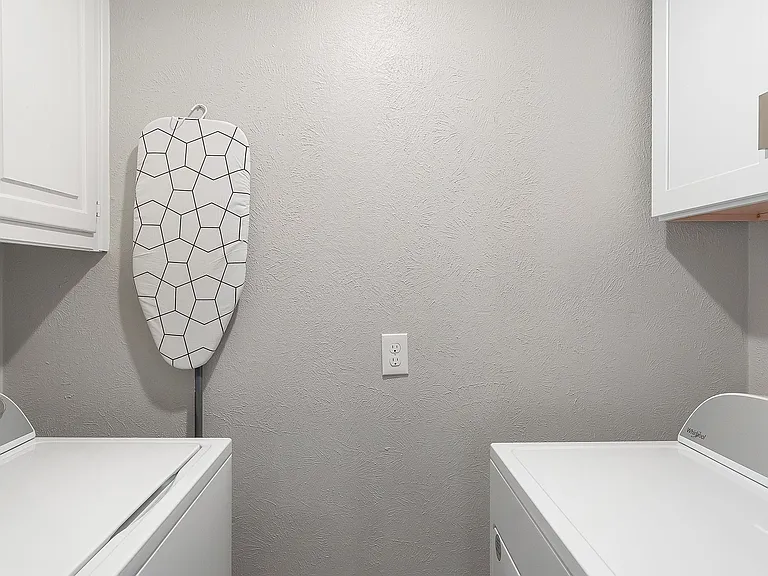 Laundry area with washer and dryer and cabinet space