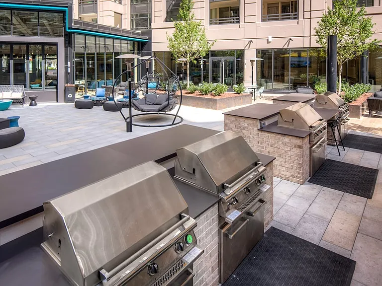 Outdoor chill space with lounge seating, barbecue grills and dining area