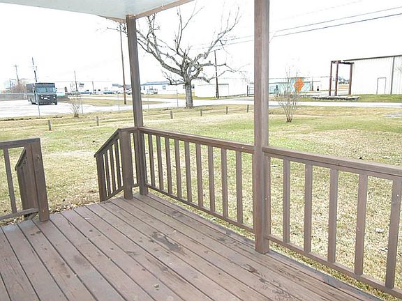 STAIRS ON BOTH SIDES OF PORCH FOR EASY ACCESS TO DOOR.