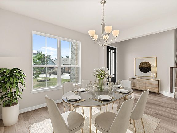 Gather the family and friends in your formal dining room, complete with gorgeous flooring and a mode