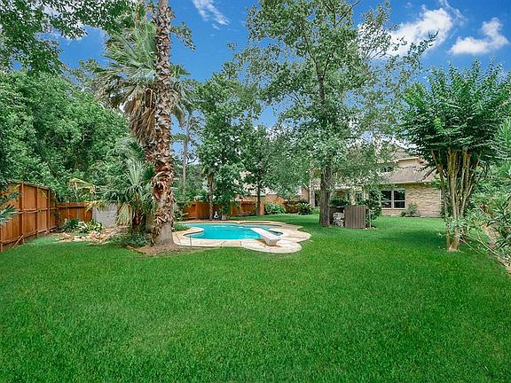View from the back, right corner of the yard, toward the back of the house.