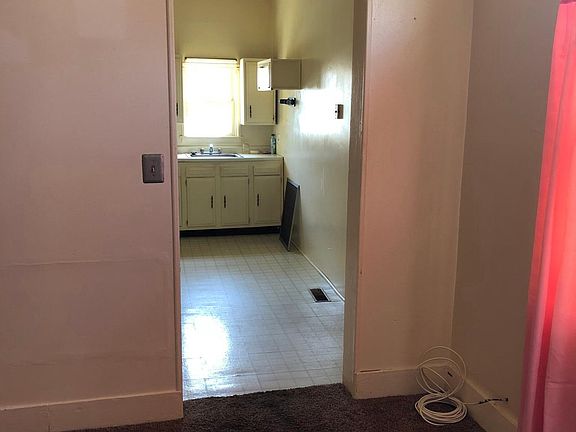 1F kitchen from LVG RM. 1 small step between rooms.