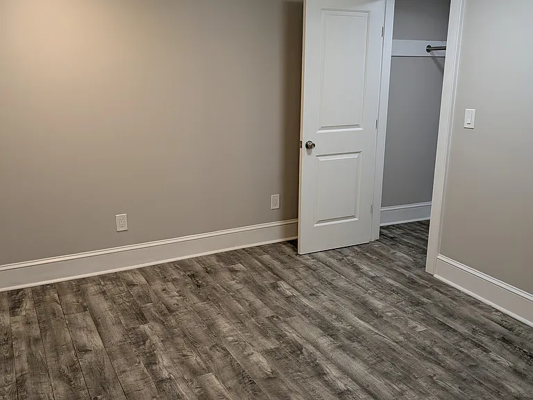 View of den with den closet door open