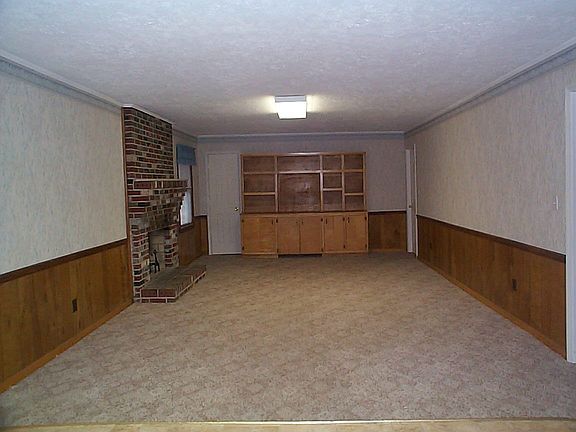 HUGE FAMILY ROOM WITH BUILT IN BOOKCASES AND FIREPLACE