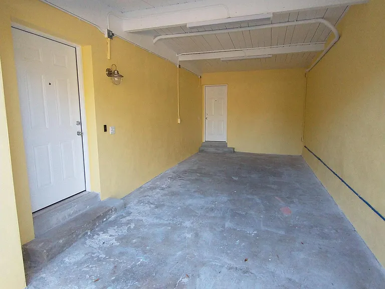 Entry door (left) and Pantry entry door (ahead). Fully private carport, converted garage
