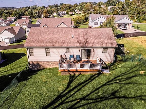Rear deck with brand new composite decking and fenced in yard.