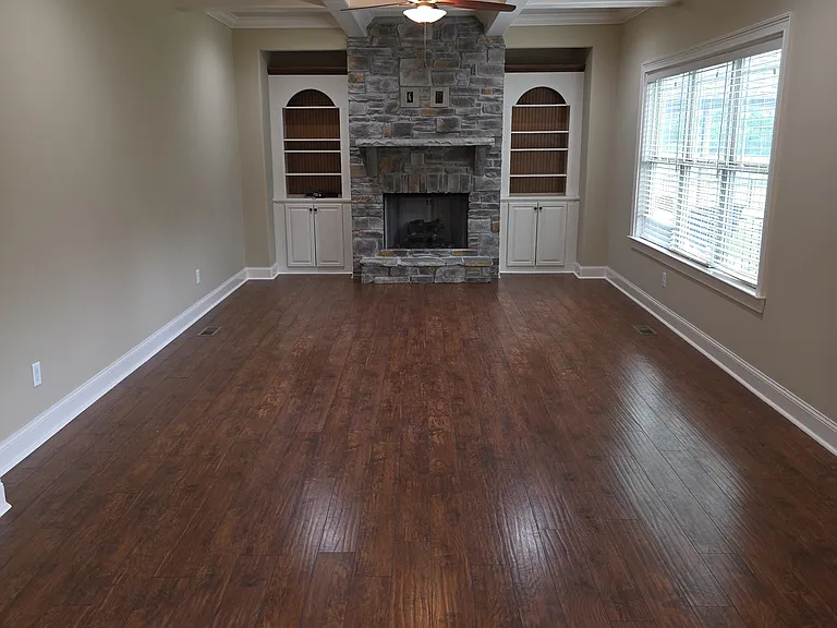 Den with built-in bookcases and cabinets. Gas fireplace (propane).
