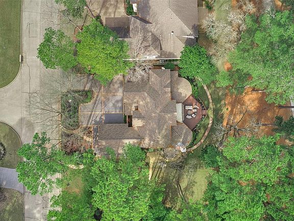 Aerial view of home on spacious golf course lot.