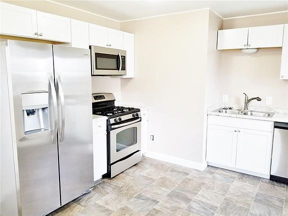 What a bright beautiful kitchen...new cabinets/tops, flooring, appliances....