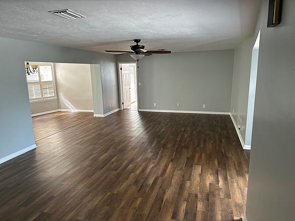 Living room viewed from outside laundry room (dining room to left & front entrance to right).