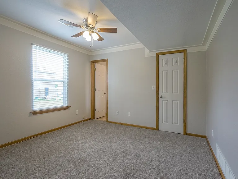 3rd bedroom lower level with dedicated bathroom and walk in closet