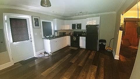 A large kitchen with new cabinets, flooring, lighting....you name it!