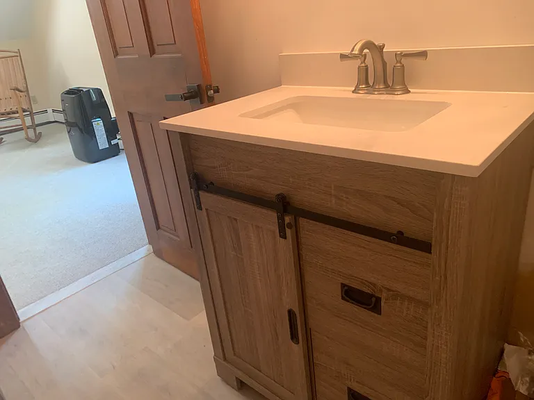Bath with new flooring and vanity