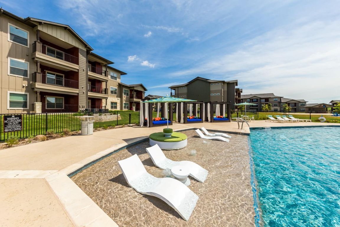 Resort Style Pool with Cabanas & Pool Loungers