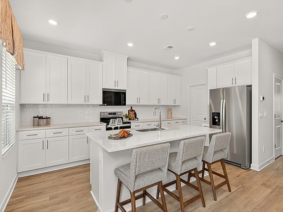 Kitchen in the Dakota floorplan at a Meritage Homes community in Charlotte, NC.