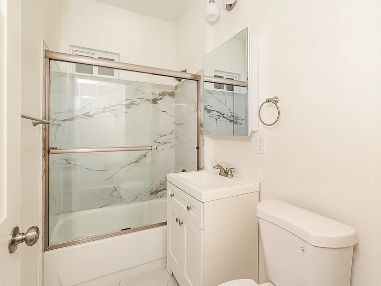 Updated bathroom with modern tile surround