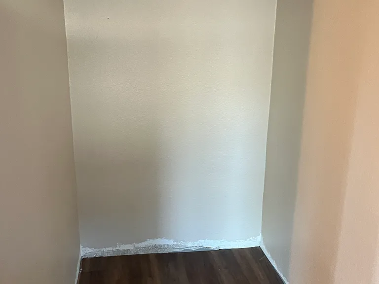 This is a small cove across from the kitchen that can be used as a breakfast nook or small home office. The area is 4'2" x 5'5". Please note the baseboard has been installed since the picture was taken.