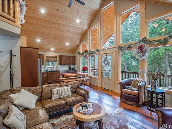 Open kitchen/living space with wall of windows to let in tons of natural light.