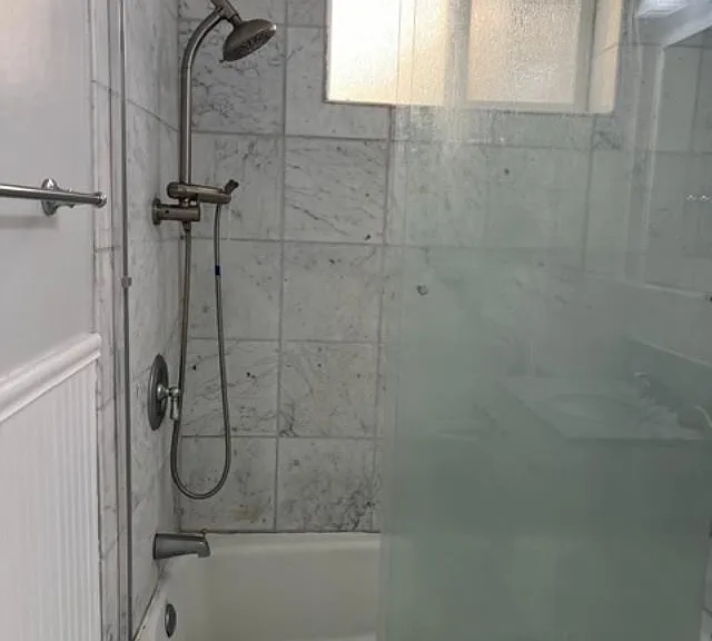 Bathroom picture 2
Tub and shower with marble stonework. Bathroom updated and modern.