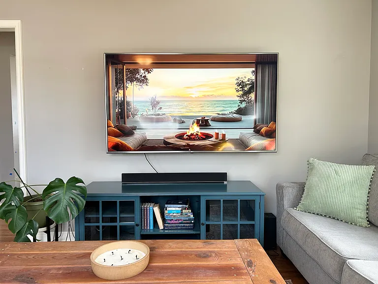 Cozy living room with two couches, ottoman and a coffee table.