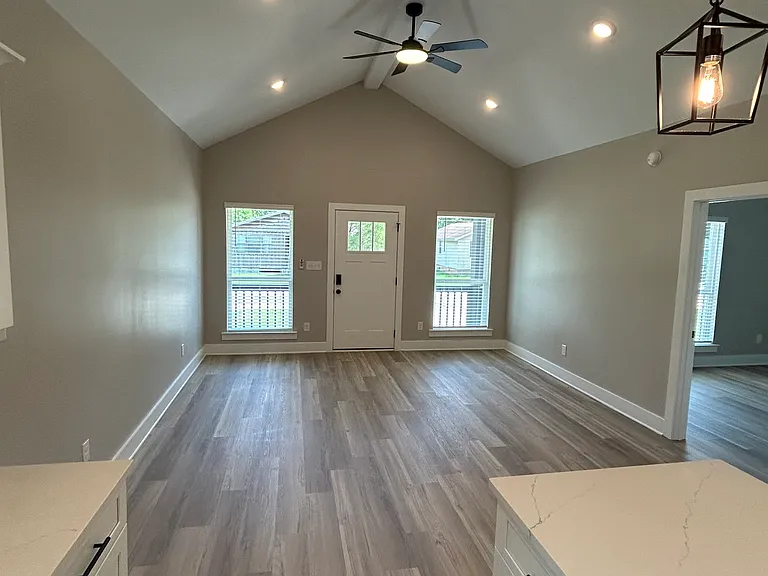 Living room with kitchen. High ceilings