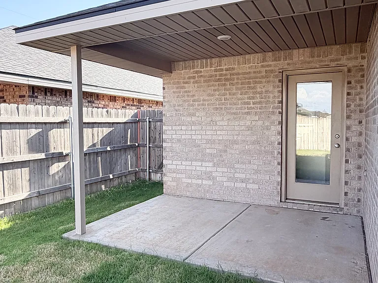 Covered porch patio. Nice sized backyard. New sod.