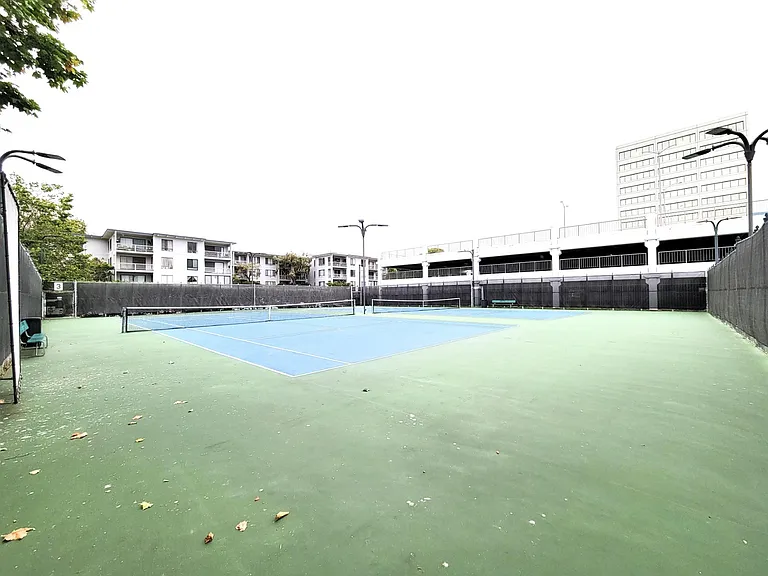 one of the two tennis courts