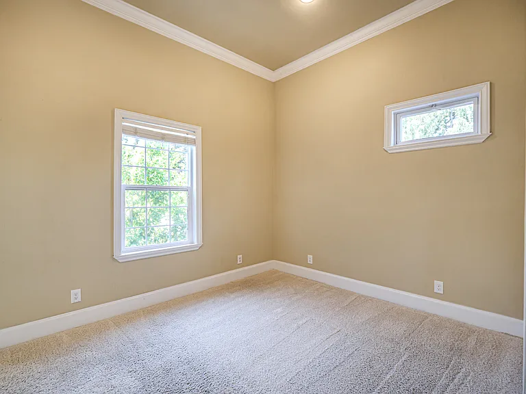 Bedroom with high ceilings