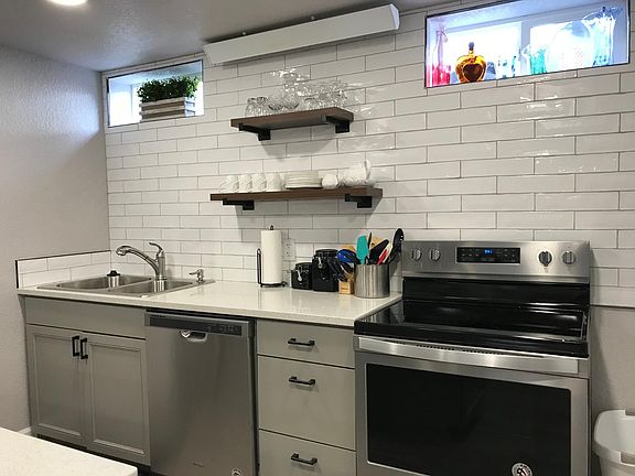 Open shelves and plenty of storage. Two new windows bring in natural light.