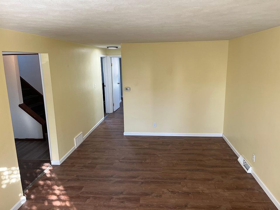 Living Room with new flooring, paint, baseboards, vents, lights, and outlets.