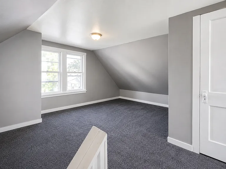 Finished upper-level room with additional flexible living space