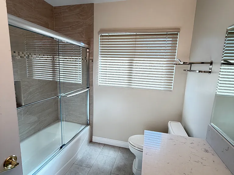 Bathroom with shower and bathtub