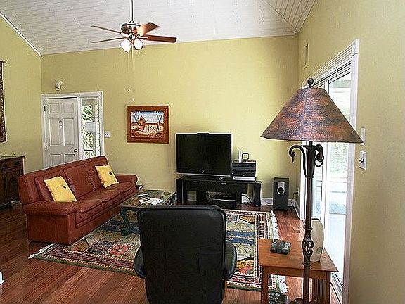 Living room with vaulted ceiling throughout