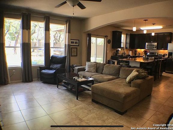 View from front door entrance of living room into kitchen