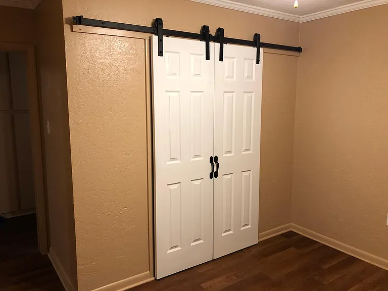 Three kids bedrooms are close on one end of house with roomy closets