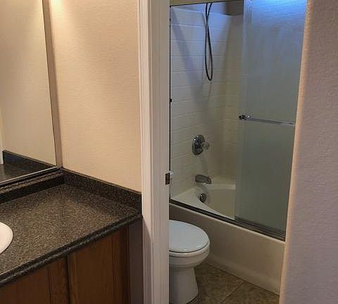 Master bathroom, separate commode and tub/shower.
