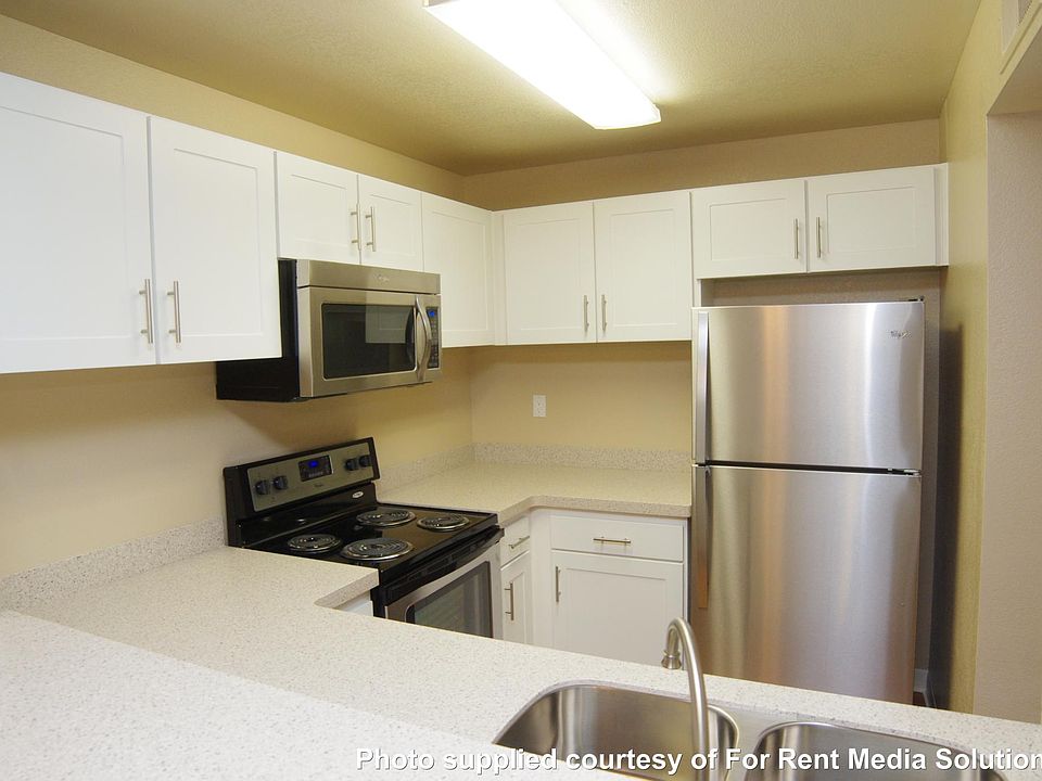 Stainless steel appliances with stone counter tops