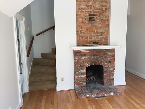 Brick Exposed decorative fireplace. The fireplace is not usable for burning wood or logs.