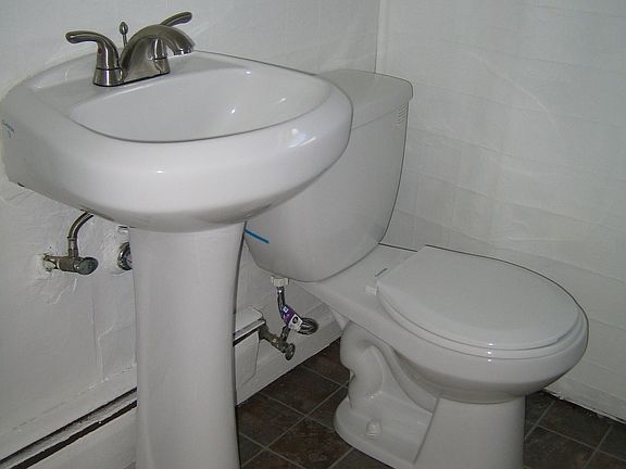 New sink, toilet, and flooring