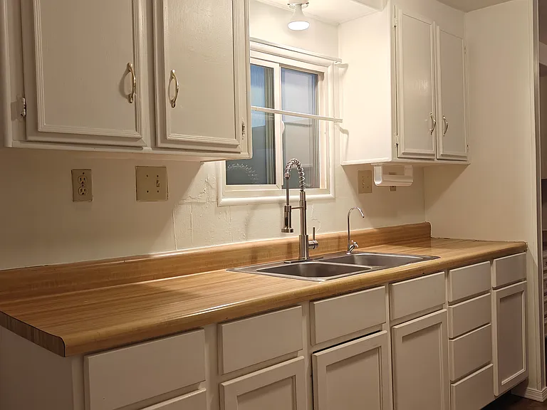 Sink side from the other end of kitchen