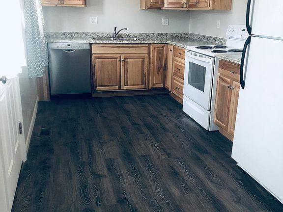 Remodeled kitchen with new cabinets and new dishwasher.