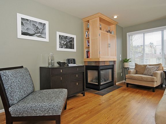 Custom entertainment cabinet over a gas fireplace.
