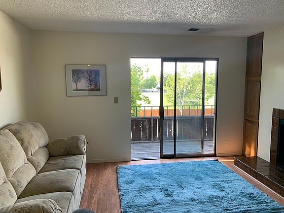 Light/bright open living room leading to balcony