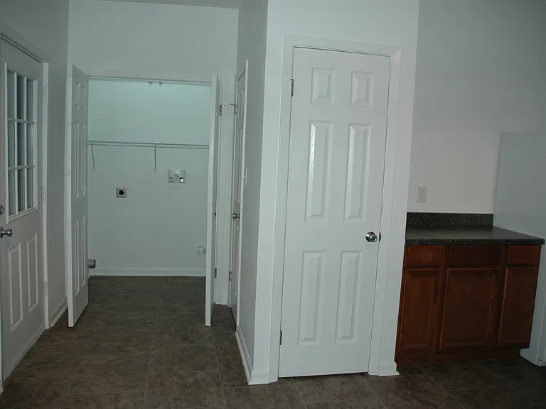 Laundry closet, utility closet, back door to deck.